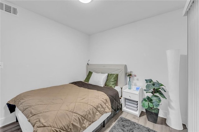 5015 Walnut St Unit A, Kansas City, MO 64112 - bedroom featuring wood finished floors