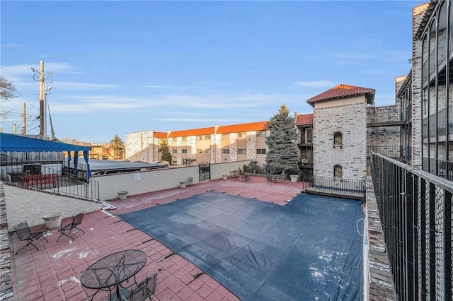 5015 Walnut St Unit A, Kansas City, MO 64112 - view of swimming pool featuring a patio