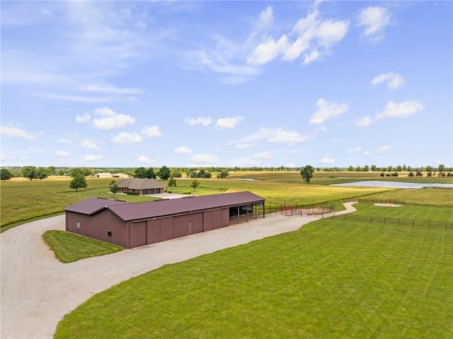 1001 E Park Rd, Garnett, KS 66032 - view of yard with an exterior structure, a water view, and an outdoor structure
