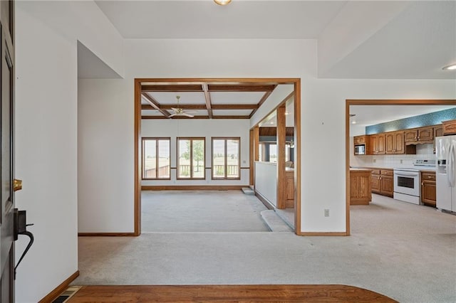 1001 E Park Rd, Garnett, KS 66032 - entryway with light carpet, coffered ceiling, a ceiling fan, and beam ceiling