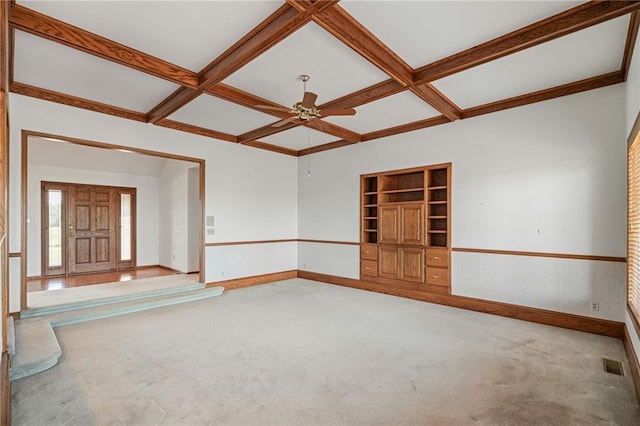 1001 E Park Rd, Garnett, KS 66032 - empty room featuring coffered ceiling, carpet floors, ceiling fan, beamed ceiling, and built in features