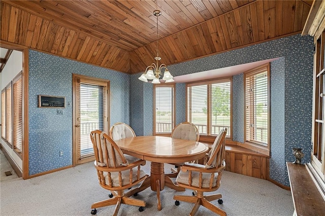 1001 E Park Rd, Garnett, KS 66032 - dining room featuring wooden ceiling, wallpapered walls, a chandelier, vaulted ceiling, and carpet