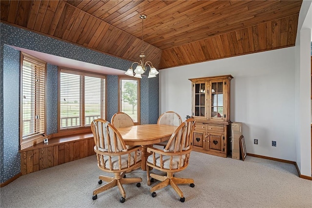 1001 E Park Rd, Garnett, KS 66032 - carpeted dining space featuring wooden ceiling, wallpapered walls, vaulted ceiling, and a chandelier