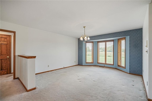 1001 E Park Rd, Garnett, KS 66032 - empty room with light carpet and a chandelier