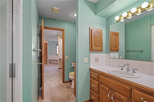 1001 E Park Rd, Garnett, KS 66032 - bathroom with vanity and backsplash