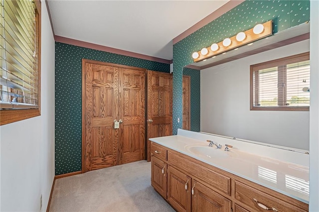 1001 E Park Rd, Garnett, KS 66032 - bathroom featuring vanity and wallpapered walls