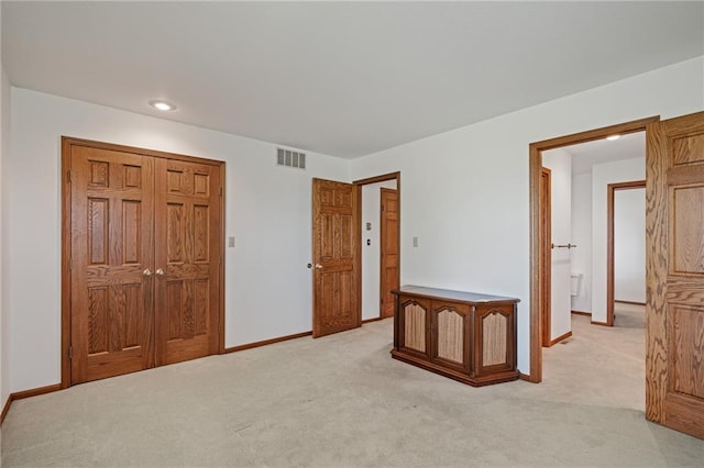 1001 E Park Rd, Garnett, KS 66032 - unfurnished bedroom with light colored carpet, a closet, and recessed lighting