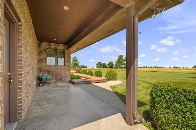 1001 E Park Rd, Garnett, KS 66032 - view of patio / terrace featuring a rural view