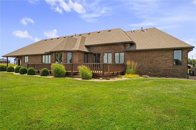 1001 E Park Rd, Garnett, KS 66032 - back of house featuring roof with shingles, a deck, and brick siding