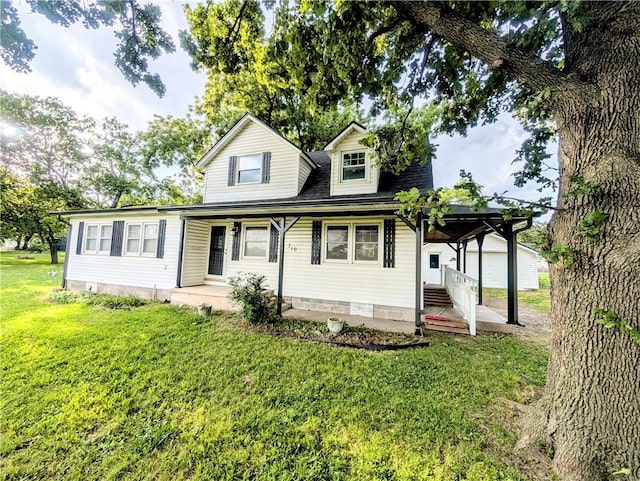 710 E Vine St, Iola, KS 66749 - view of front of property with a front yard and covered porch