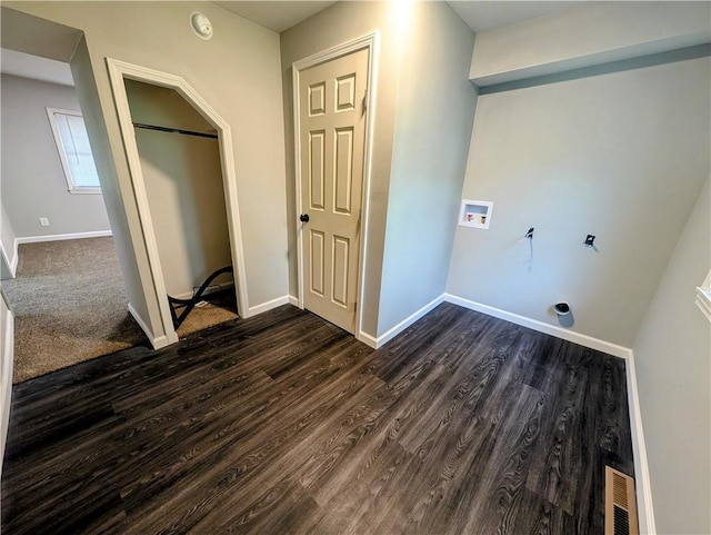 710 E Vine St, Iola, KS 66749 - laundry room featuring hookup for a washing machine and dark wood-style floors