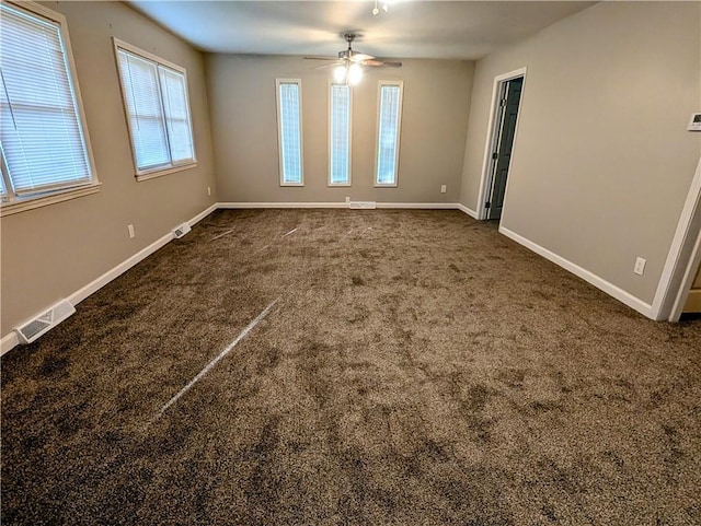 710 E Vine St, Iola, KS 66749 - unfurnished room with a ceiling fan and dark colored carpet