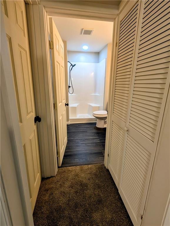 710 E Vine St, Iola, KS 66749 - hallway with dark colored carpet