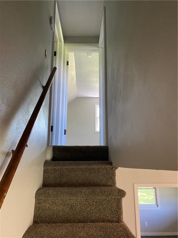 710 E Vine St, Iola, KS 66749 - stairs featuring vaulted ceiling