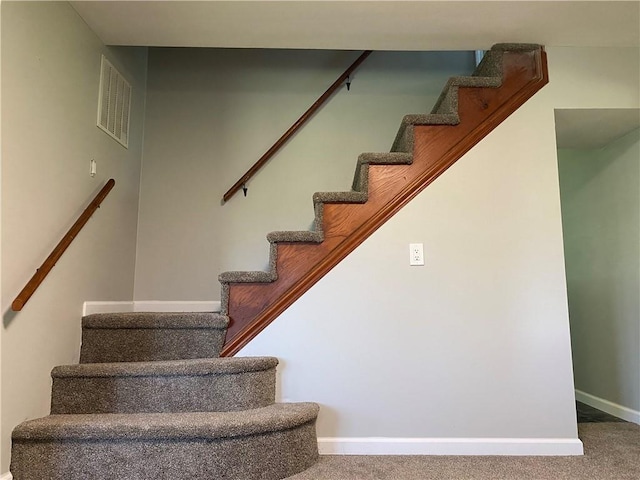 710 E Vine St, Iola, KS 66749 - staircase with carpet floors and baseboards
