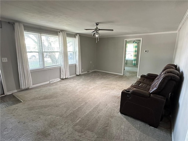 131 E Warren St, Gardner, KS 66030 - living area featuring carpet, ceiling fan, and crown molding