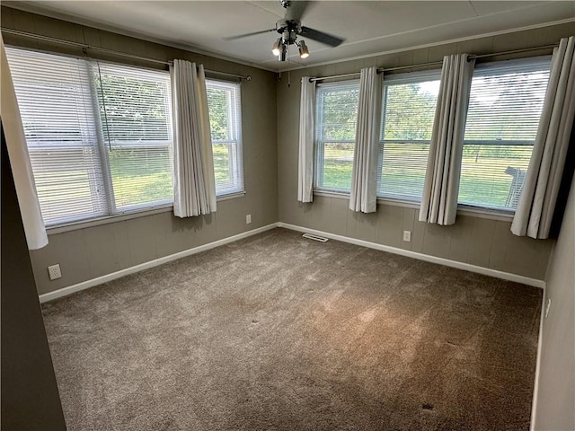 131 E Warren St, Gardner, KS 66030 - spare room with dark colored carpet and a ceiling fan
