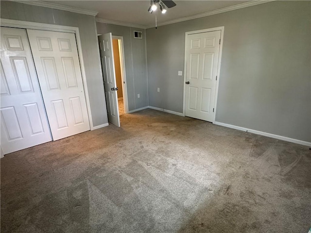 131 E Warren St, Gardner, KS 66030 - unfurnished bedroom featuring carpet floors, crown molding, a closet, and ceiling fan