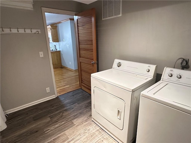 131 E Warren St, Gardner, KS 66030 - laundry area with separate washer and dryer and dark wood-style floors