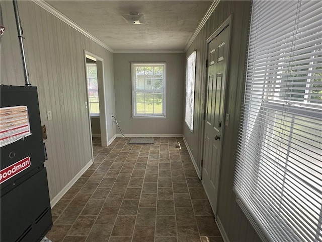 131 E Warren St, Gardner, KS 66030 - entryway with ornamental molding, heating unit, wood walls, and brick patterned flooring