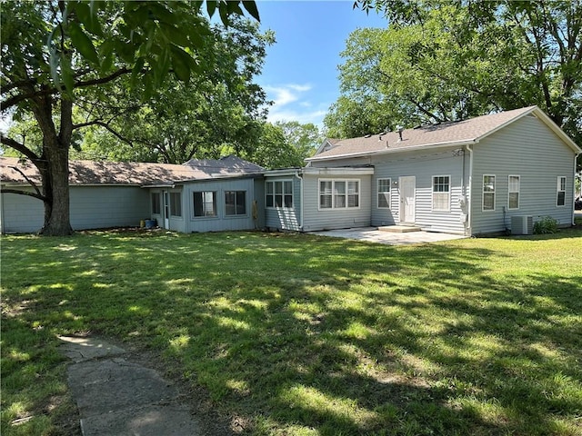 131 E Warren St, Gardner, KS 66030 - rear view of house with a patio area and a yard