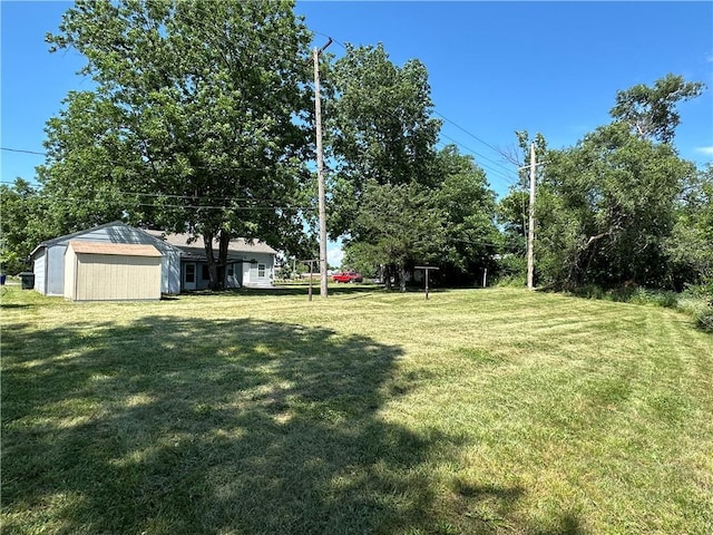 131 E Warren St, Gardner, KS 66030 - view of green lawn featuring a storage unit