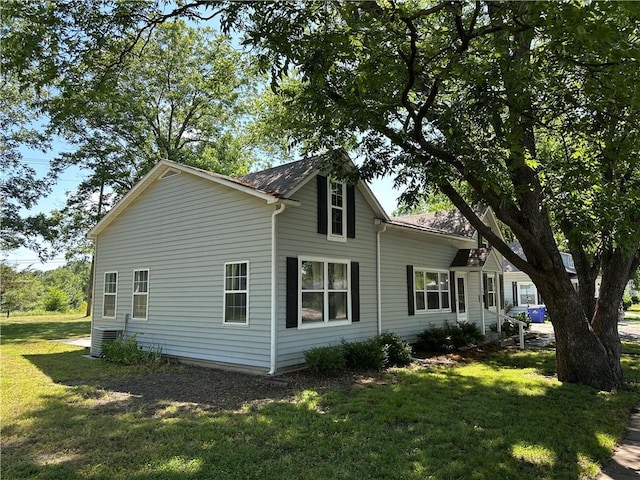 131 E Warren St, Gardner, KS 66030 - view of side of home with a yard and a cooling unit