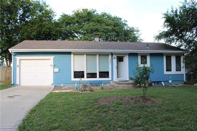 4301 James Ave, Independence, MO 64055 - ranch-style house featuring a garage, driveway, a front yard, stucco siding, and roof with shingles