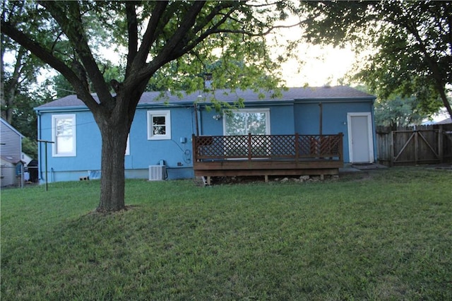4301 James Ave, Independence, MO 64055 - back of property with a deck and stucco siding