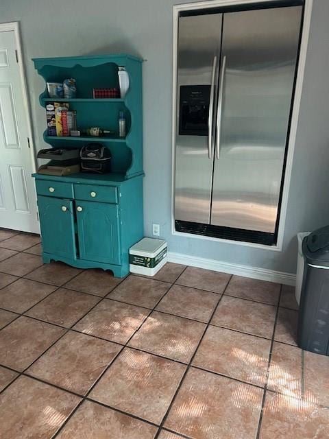 4301 James Ave, Independence, MO 64055 - kitchen with stainless steel fridge with ice dispenser, green cabinets, tile patterned flooring, open shelves, and dark countertops