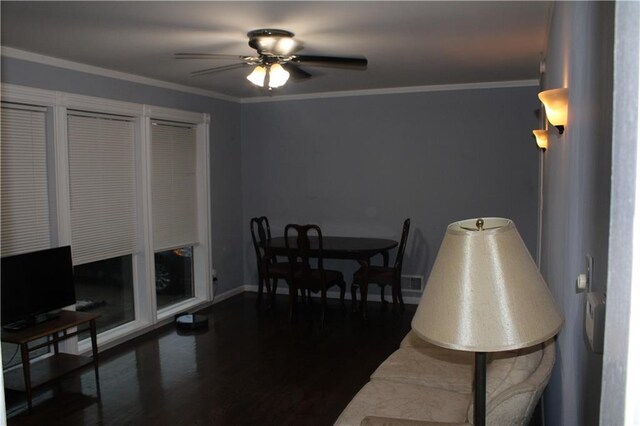 4301 James Ave, Independence, MO 64055 - dining area with ceiling fan, dark wood-style floors, and ornamental molding