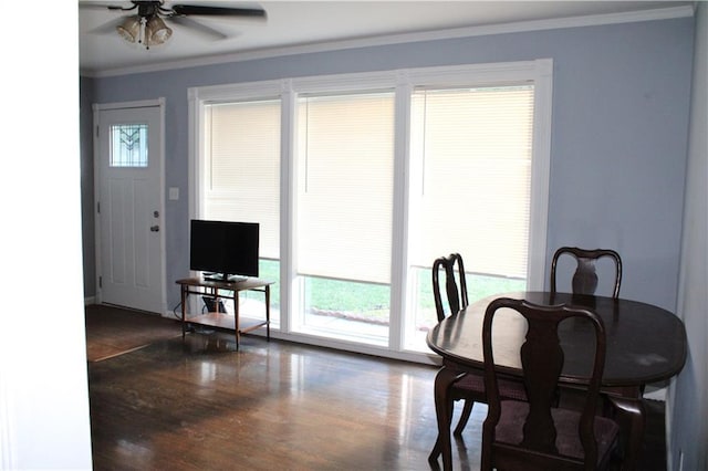 4301 James Ave, Independence, MO 64055 - dining space with crown molding, plenty of natural light, a ceiling fan, and wood finished floors