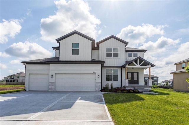 16941 S Brentwood St, Olathe, KS 66062 - view of front of home with a front yard, an attached garage, concrete driveway, board and batten siding, and covered porch