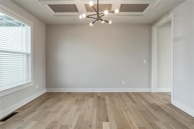 16941 S Brentwood St, Olathe, KS 66062 - unfurnished dining area with a chandelier, light wood-type flooring, and coffered ceiling