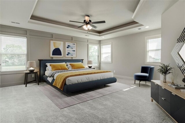 16941 S Brentwood St, Olathe, KS 66062 - bedroom with a raised ceiling, light colored carpet, and a ceiling fan