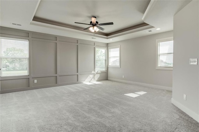 16941 S Brentwood St, Olathe, KS 66062 - unfurnished bedroom featuring a tray ceiling, carpet, ceiling fan, and recessed lighting
