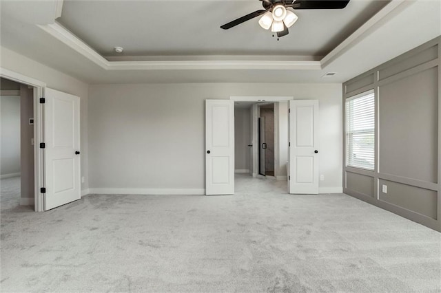 16941 S Brentwood St, Olathe, KS 66062 - unfurnished bedroom featuring a raised ceiling, carpet floors, and ceiling fan