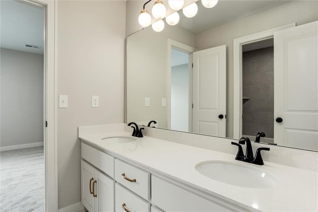 16941 S Brentwood St, Olathe, KS 66062 - full bathroom featuring double vanity and baseboards