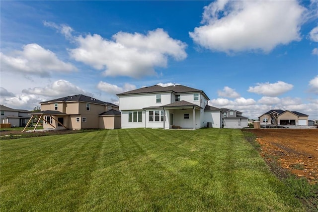 16941 S Brentwood St, Olathe, KS 66062 - back of property featuring a yard