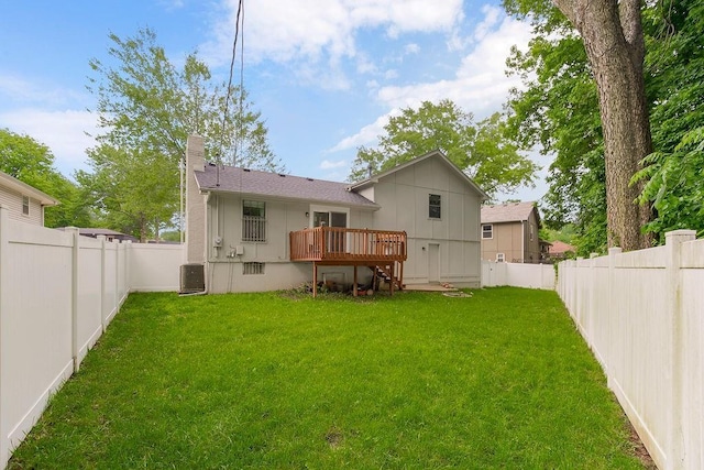 7921 Yecker St, Kansas City, KS 66102 - rear view of house featuring a wooden deck, a fenced backyard, a chimney, and stairway