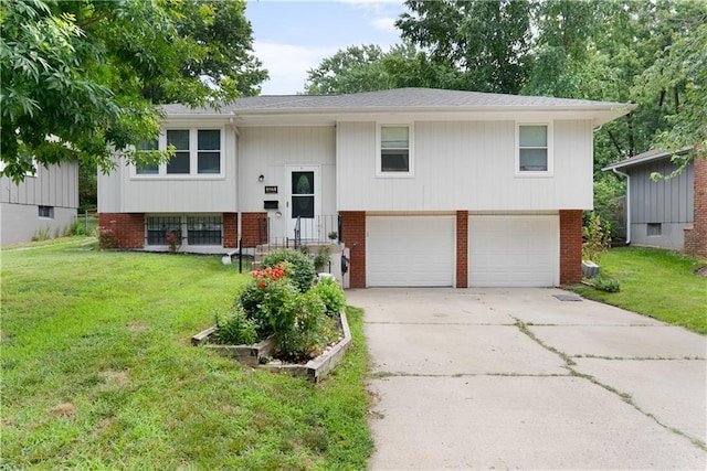13211 Craig Ave, Grandview, MO 64030 - raised ranch featuring a garage, concrete driveway, brick siding, and a front yard