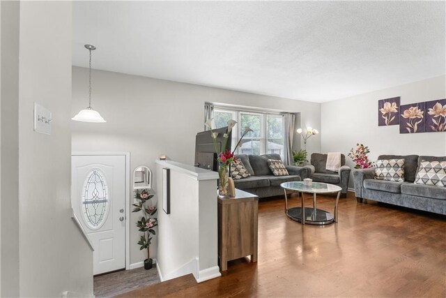 13211 Craig Ave, Grandview, MO 64030 - living room featuring dark wood-type flooring