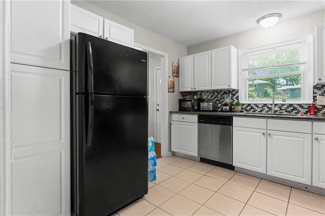 13211 Craig Ave, Grandview, MO 64030 - kitchen featuring black appliances, decorative backsplash, white cabinetry, and a textured ceiling