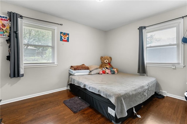 13211 Craig Ave, Grandview, MO 64030 - bedroom featuring wood finished floors and baseboards