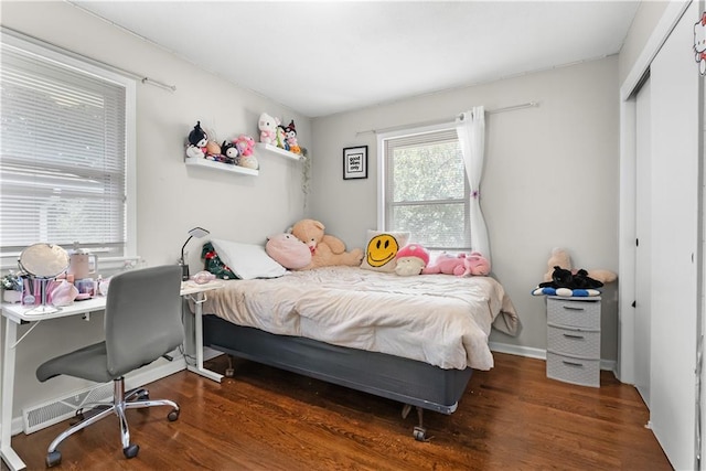 13211 Craig Ave, Grandview, MO 64030 - bedroom featuring wood finished floors, a closet, and an office area