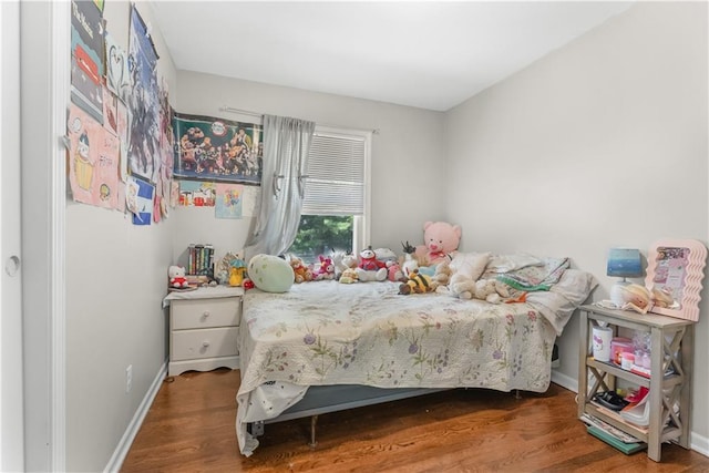13211 Craig Ave, Grandview, MO 64030 - bedroom with wood finished floors and baseboards