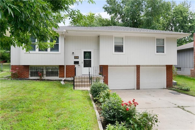 13211 Craig Ave, Grandview, MO 64030 - bi-level home featuring an attached garage, a front yard, concrete driveway, and brick siding