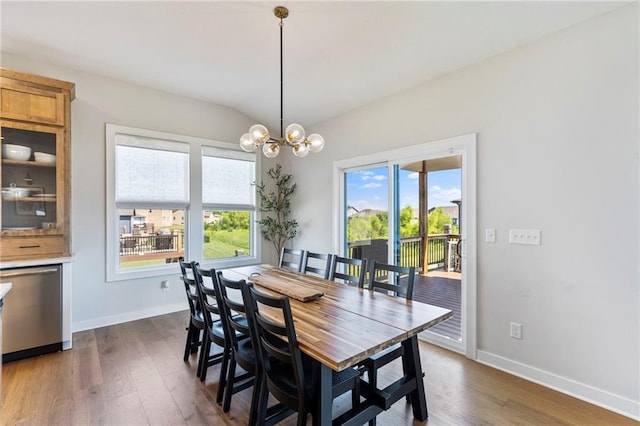 19013 W 188th Ter, Spring Hill, KS 66083 - dining area featuring dark wood-style floors, lofted ceiling, and a chandelier