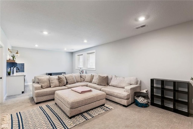19013 W 188th Ter, Spring Hill, KS 66083 - carpeted living room featuring recessed lighting and a sink