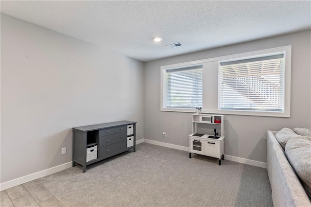 19013 W 188th Ter, Spring Hill, KS 66083 - interior space with a textured ceiling and light colored carpet